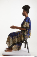 Dina Moses  1 dressed sitting traditional decora long african dress whole body 0009.jpg